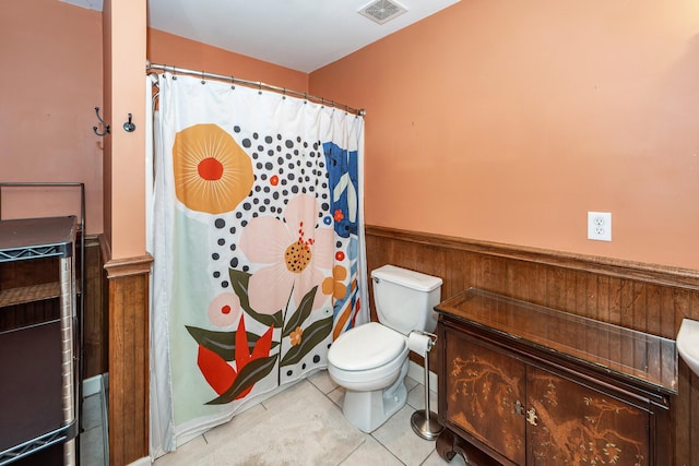 477 Commonwealth Rd, Mount Pleasant, SC 29466 - bathroom featuring a wainscoted wall, tile patterned flooring, and a shower with shower curtain