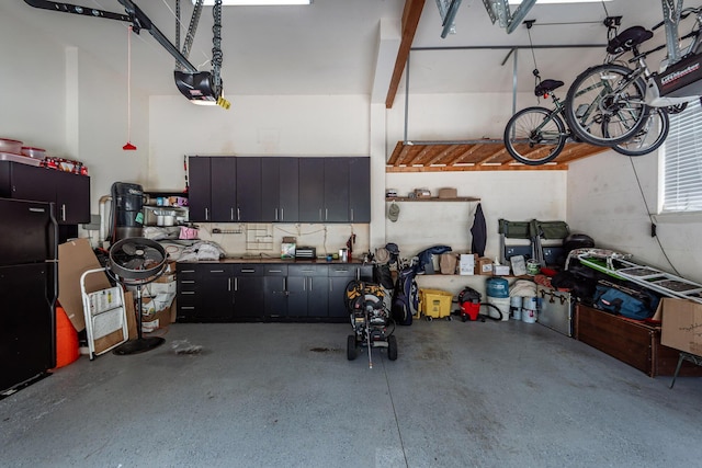 477 Commonwealth Rd, Mount Pleasant, SC 29466 - garage with freestanding refrigerator and a garage door opener