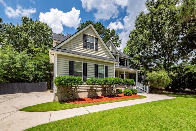 477 Commonwealth Rd, Mount Pleasant, SC 29466 - traditional-style home with a porch and roof with shingles