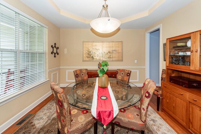 477 Commonwealth Rd, Mount Pleasant, SC 29466 - dining space featuring wood finished floors and a tray ceiling