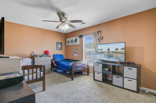 bedroom with visible vents, baseboards, a ceiling fan, and carpet flooring