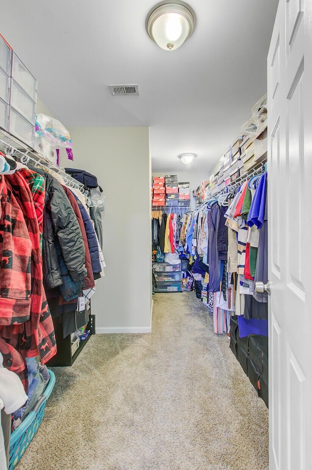 spacious closet with visible vents and carpet floors