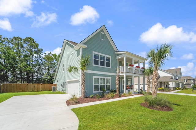 1973 Parish House Cir, Johns Island, SC 29455 - view of front of house with an attached garage, a balcony, and driveway