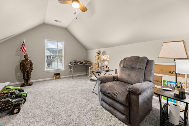 living area with lofted ceiling, carpet floors, and ceiling fan