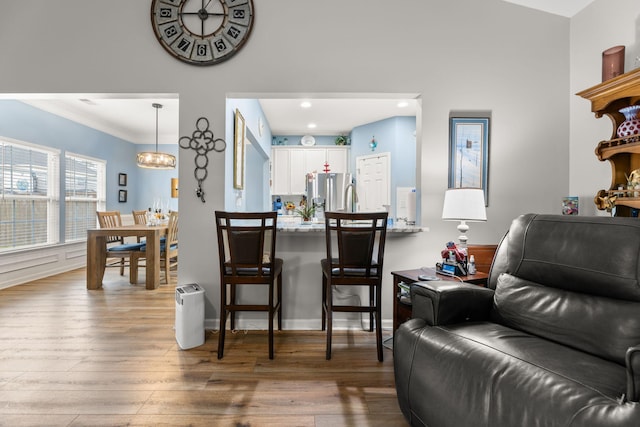 interior space featuring an inviting chandelier and hardwood / wood-style floors