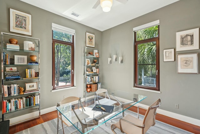 interior space with ceiling fan and hardwood / wood-style floors