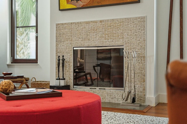 interior details featuring hardwood / wood-style flooring and a fireplace