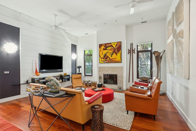 living room with hardwood / wood-style flooring and ceiling fan