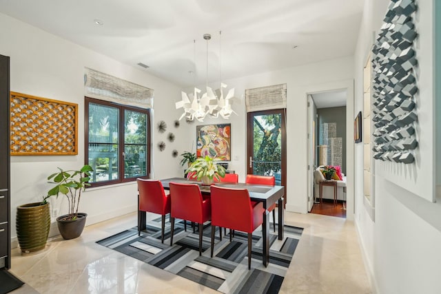 dining room featuring a notable chandelier