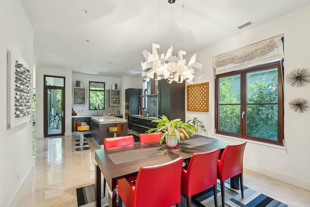 dining room featuring a chandelier