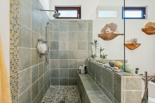 bathroom with a tile shower