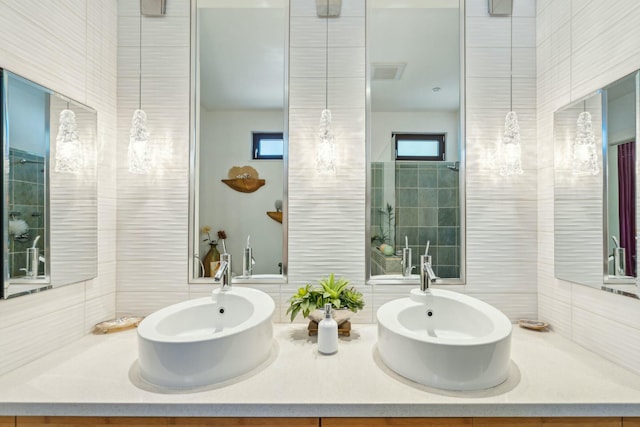 bathroom with decorative backsplash, vanity, and tile walls