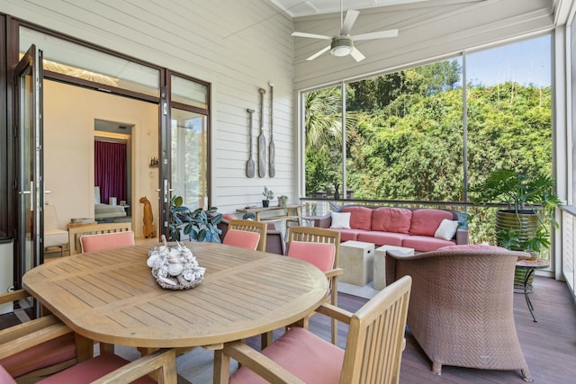 sunroom / solarium featuring ceiling fan