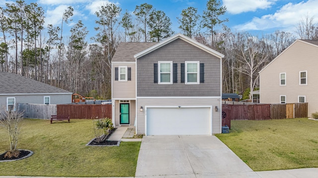 view of front facade featuring an attached garage, driveway, a front yard, and fence