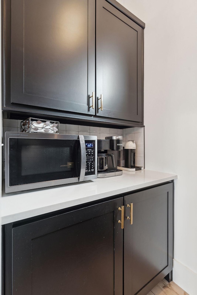 231 Bayview Dr, Mount Pleasant, SC 29464 - bar with stainless steel microwave and tasteful backsplash