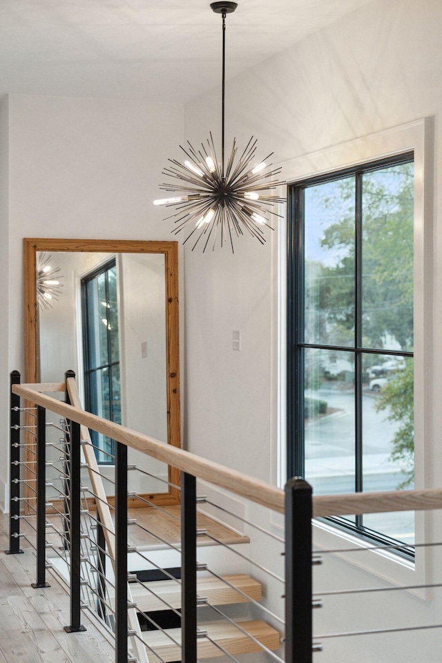 231 Bayview Dr, Mount Pleasant, SC 29464 - corridor featuring an upstairs landing, a chandelier, and light wood-type flooring