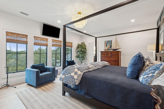 231 Bayview Dr, Mount Pleasant, SC 29464 - bedroom featuring a chandelier, wood finished floors, and recessed lighting