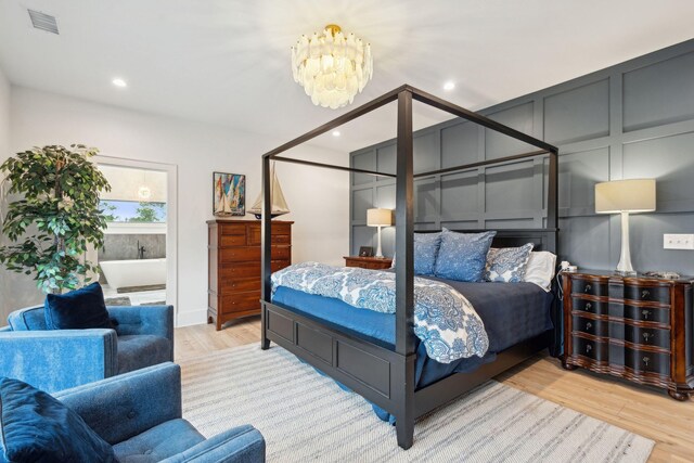231 Bayview Dr, Mount Pleasant, SC 29464 - bedroom with wood finished floors, a chandelier, and recessed lighting