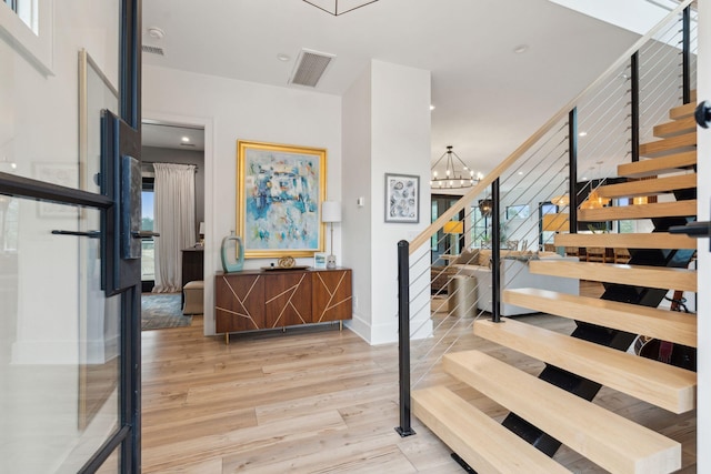 231 Bayview Dr, Mount Pleasant, SC 29464 - stairs featuring wood finished floors, a chandelier, baseboards, and recessed lighting
