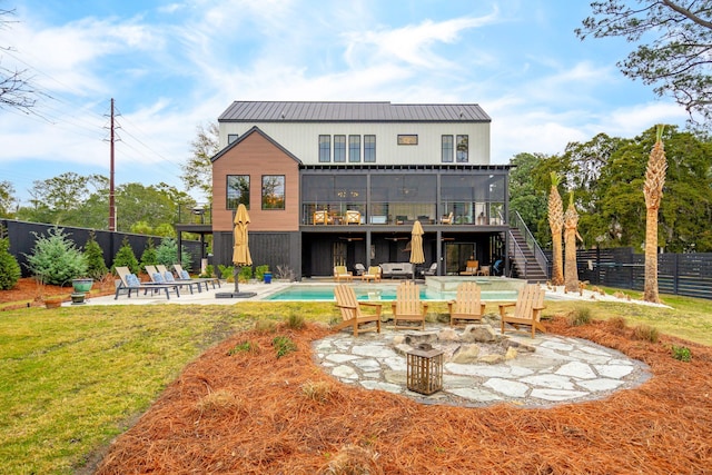 231 Bayview Dr, Mount Pleasant, SC 29464 - rear view of house featuring stairs, a patio area, a balcony, an outdoor fire pit, and metal roof