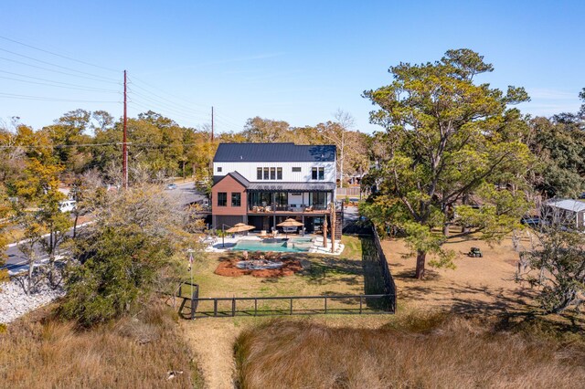 231 Bayview Dr, Mount Pleasant, SC 29464 - rear view of house with a deck, metal roof, and an outdoor pool