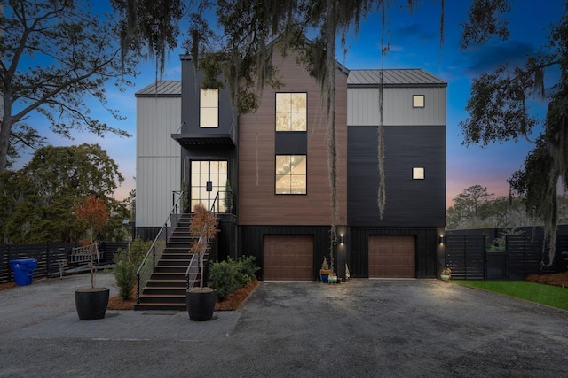 231 Bayview Dr, Mount Pleasant, SC 29464 - view of front facade with driveway, a standing seam roof, stairway, an attached garage, and metal roof