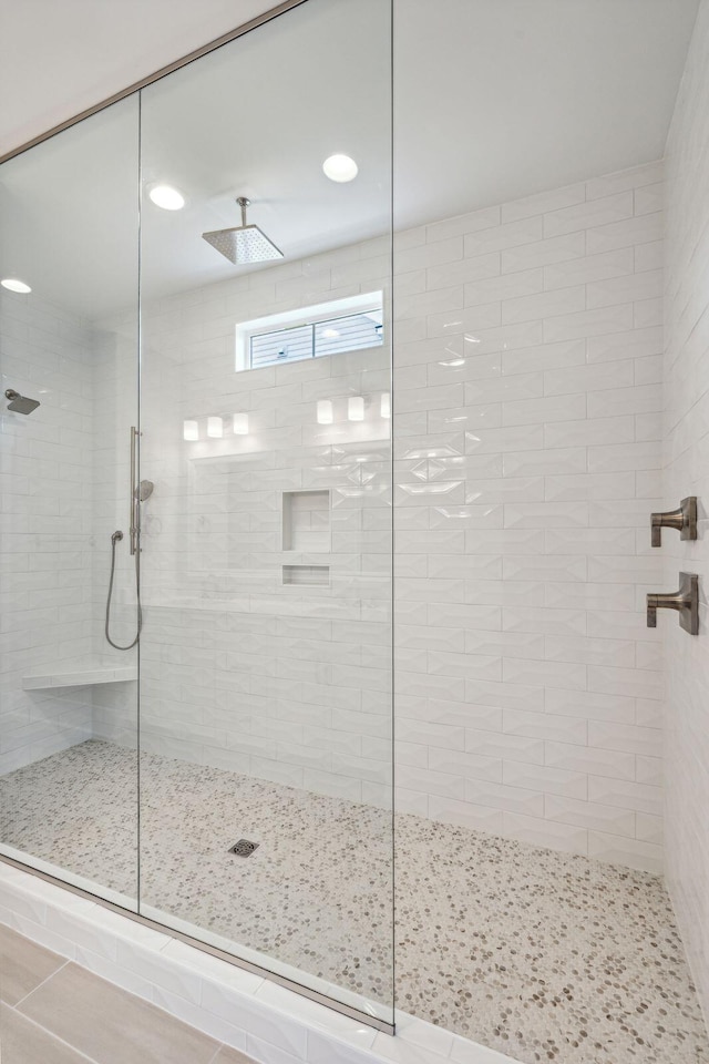 bathroom with a tile shower