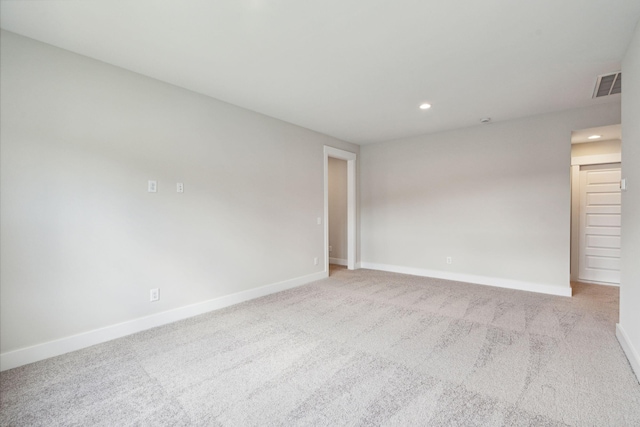 empty room with light colored carpet