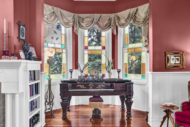 living area with a wainscoted wall