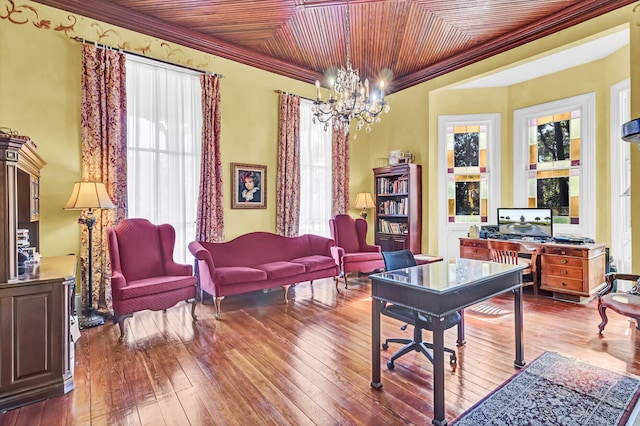 office area with ornamental molding, an inviting chandelier, and hardwood / wood-style flooring