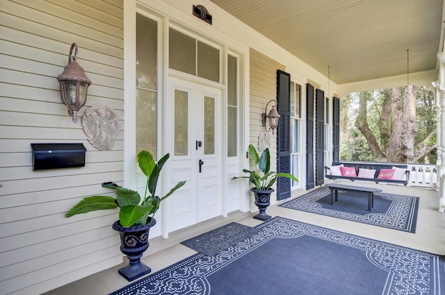 property entrance featuring a porch