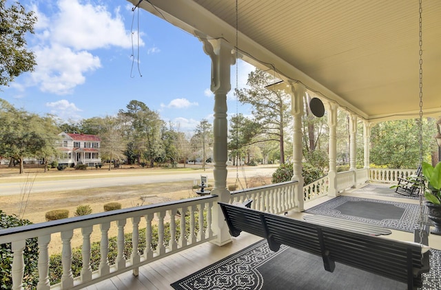 wooden terrace featuring a porch