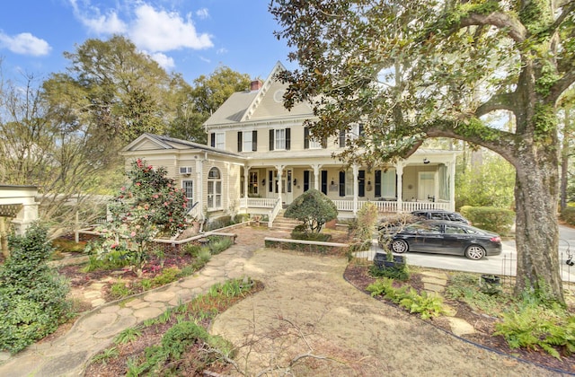 view of front of house with a porch and a chimney