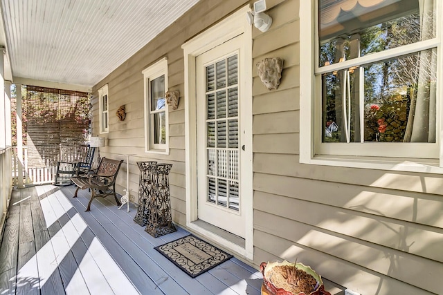 wooden deck featuring covered porch