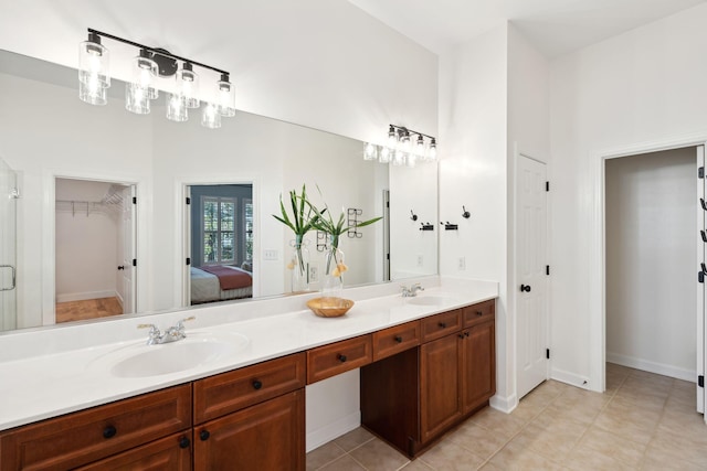 bathroom with vanity and tile patterned flooring