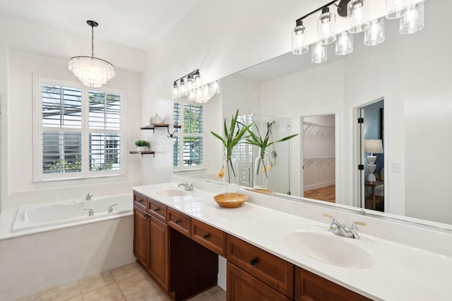 bathroom featuring tile patterned flooring, vanity, and a bathtub