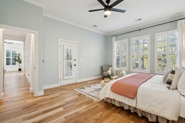 bedroom featuring access to exterior, crown molding, light hardwood / wood-style floors, and ceiling fan