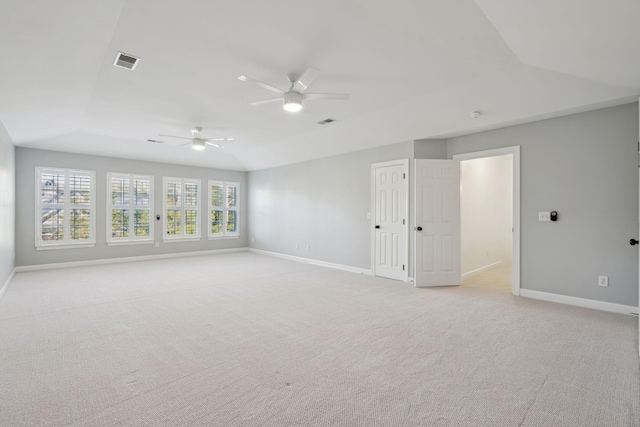 spare room featuring ceiling fan and light colored carpet