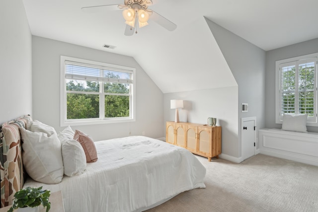 591 Island Walk E, Mount Pleasant, SC 29464 - bedroom featuring multiple windows, light colored carpet, lofted ceiling, and a ceiling fan
