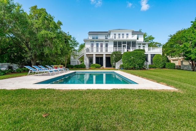591 Island Walk E, Mount Pleasant, SC 29464 - rear view of house featuring stairway, an outdoor pool, a yard, a sunroom, and a patio