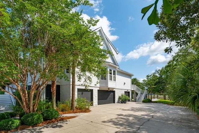 591 Island Walk E, Mount Pleasant, SC 29464 - view of front of property featuring stairs, concrete driveway, and an attached garage