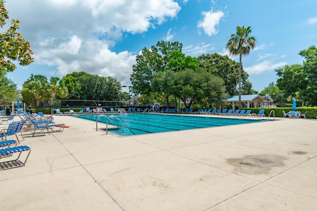 591 Island Walk E, Mount Pleasant, SC 29464 - community pool with a patio area and view of wooded area
