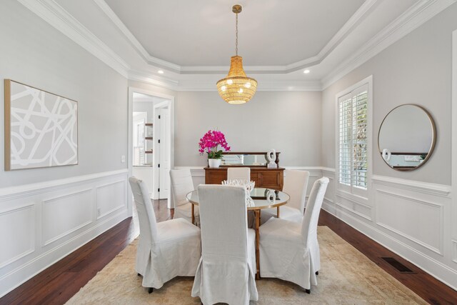 591 Island Walk E, Mount Pleasant, SC 29464 - dining area with hardwood / wood-style flooring, recessed lighting, ornamental molding, a wainscoted wall, and a raised ceiling