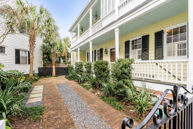 exterior space with a balcony and a porch