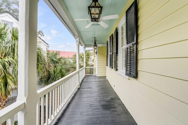 balcony featuring a sunroom and ceiling fan