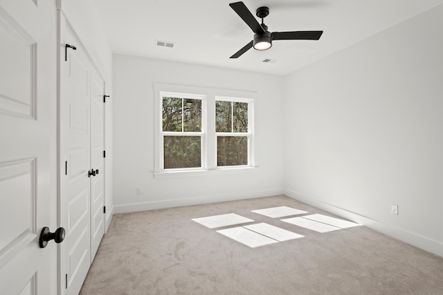 71 Downing Dr, Beaufort, SC 29907 - unfurnished bedroom featuring light carpet, a closet, baseboards, and ceiling fan
