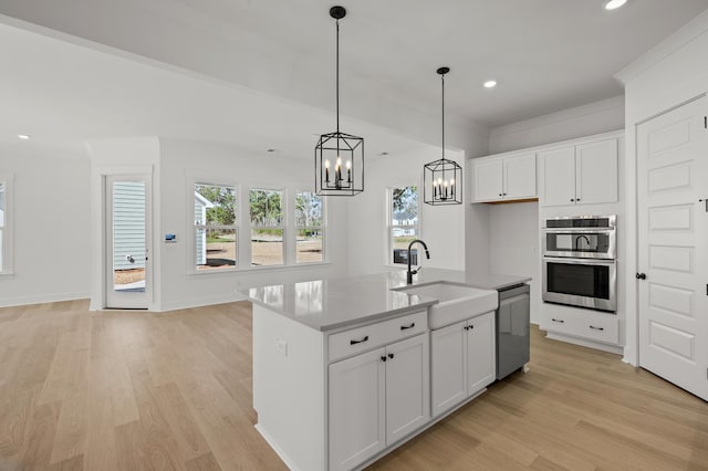 71 Downing Dr, Beaufort, SC 29907 - kitchen featuring a sink, stainless steel appliances, light wood finished floors, white cabinetry, and recessed lighting