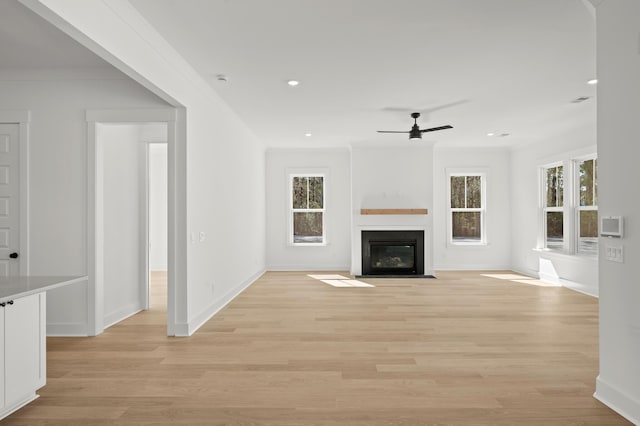 71 Downing Dr, Beaufort, SC 29907 - unfurnished living room with a ceiling fan, a fireplace with flush hearth, baseboards, light wood finished floors, and recessed lighting