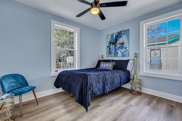 bedroom featuring light hardwood / wood-style flooring and ceiling fan