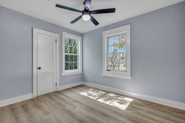 spare room featuring ceiling fan and light hardwood / wood-style floors